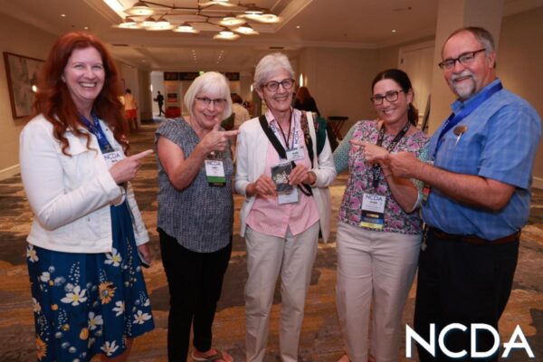 Five individuals at the NCDA conference